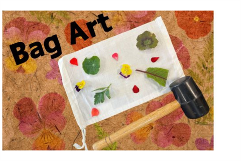 Picture of a bag with flowers laying on it, a rubber mallet on the side 